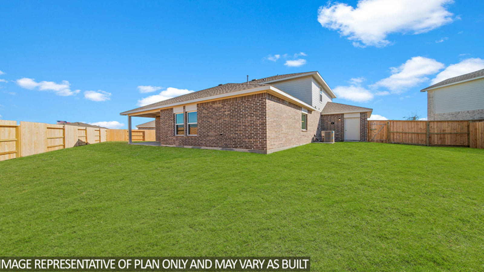 Spacious backyard with patio.