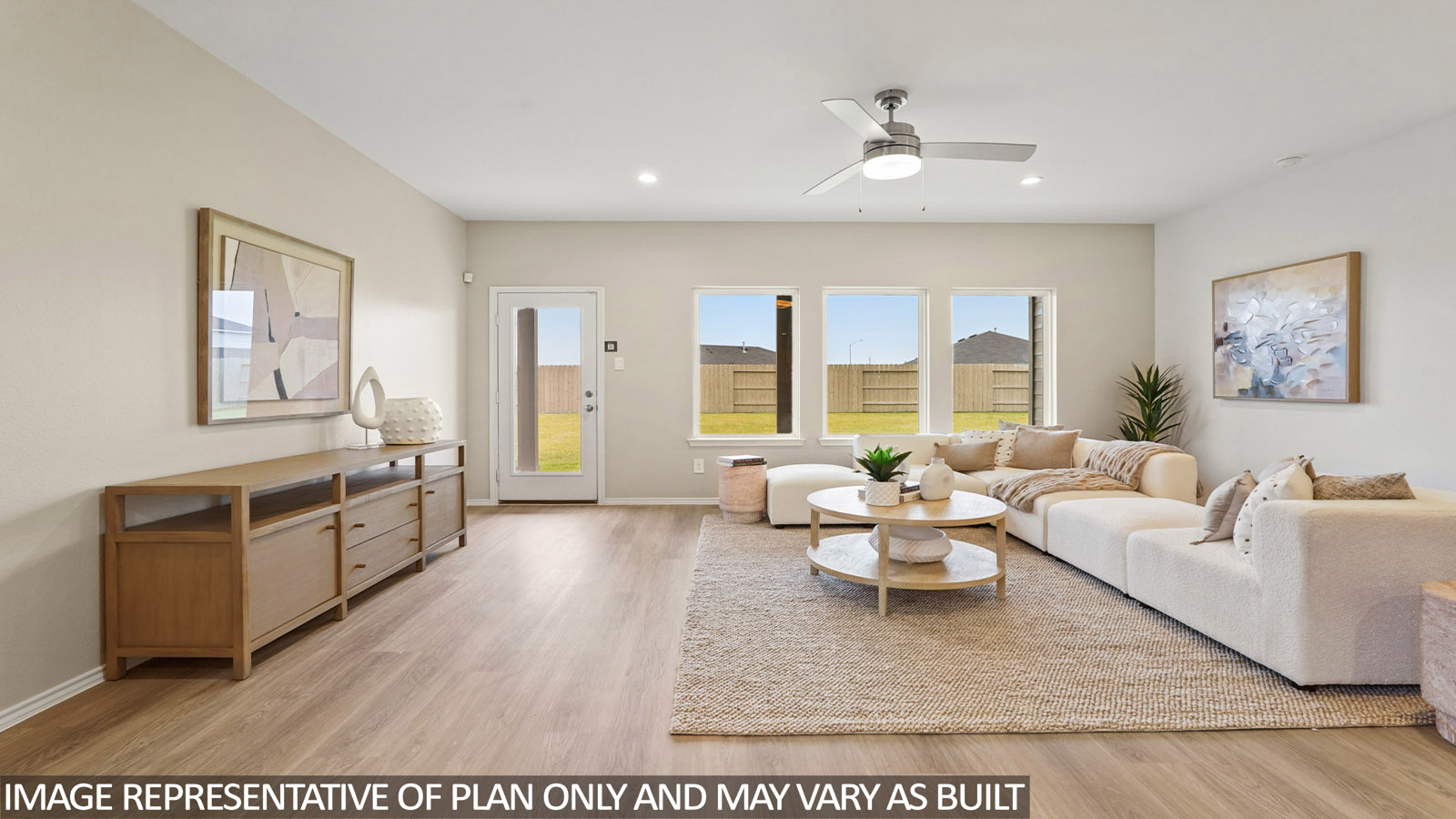 Spacious living area with vinyl flooring