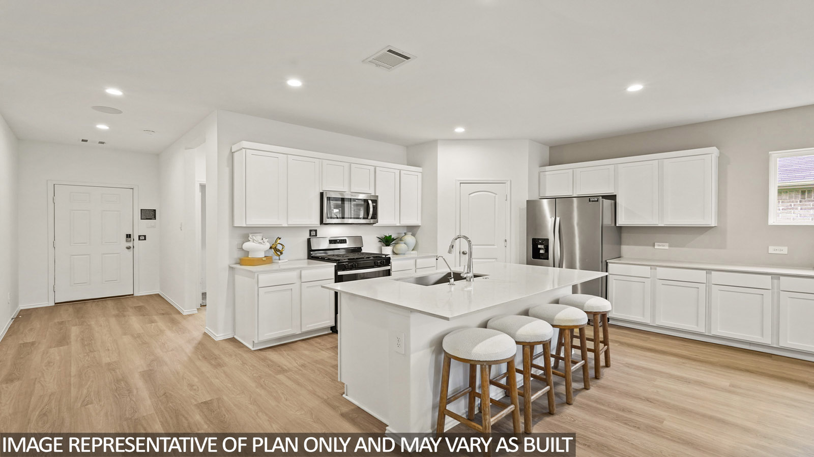 Kitchen with an island and vinyl floor