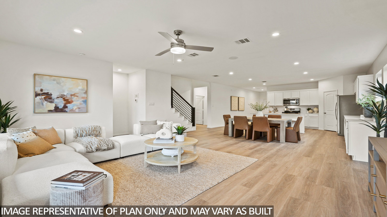 Spacious living area with vinyl flooring