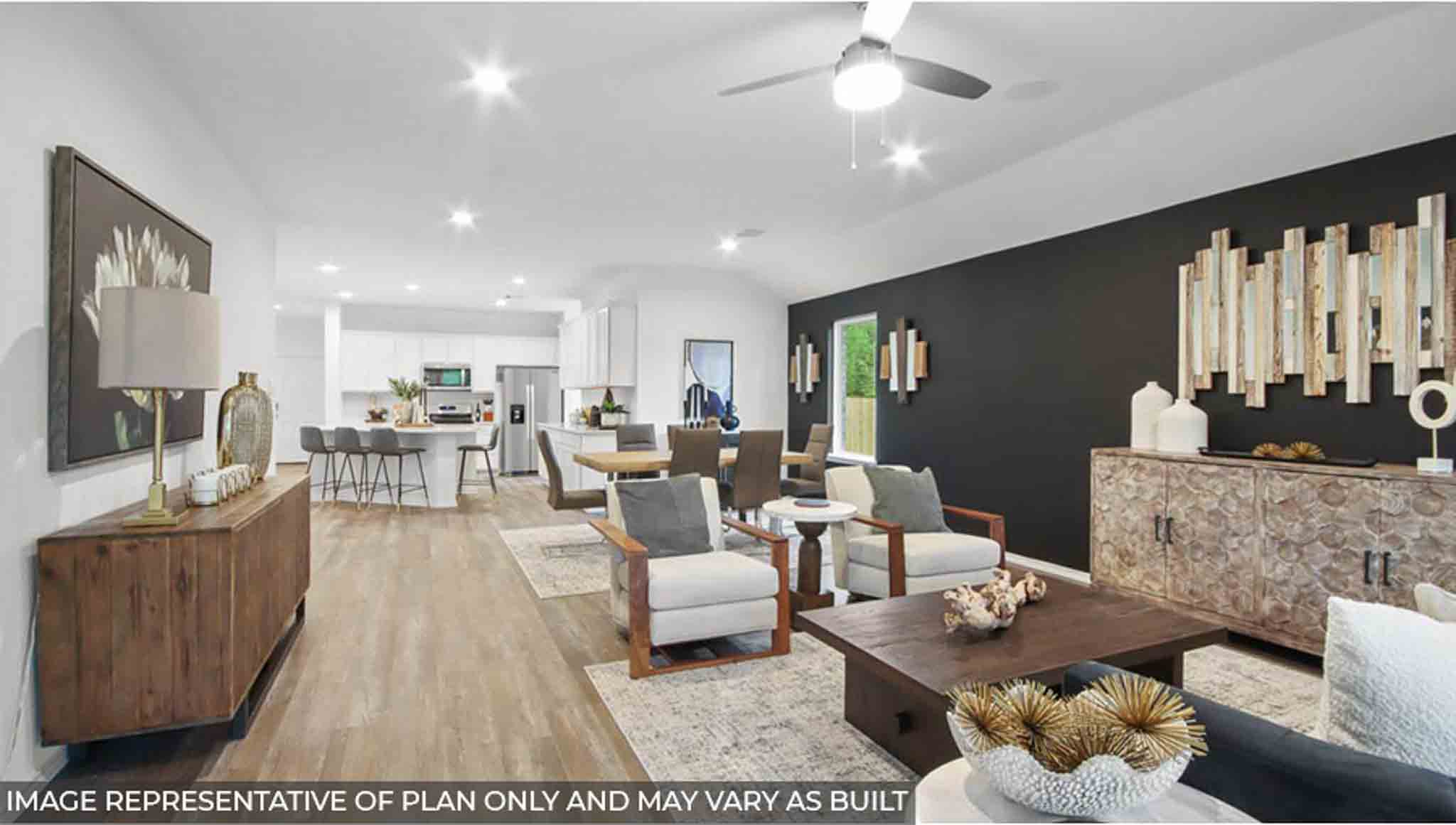 Spacious living area with vinyl flooring