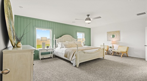 Primary bedroom with carpet flooring