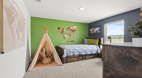 Secondary bedroom with carpet flooring