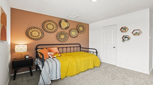 Secondary bedroom with carpet flooring