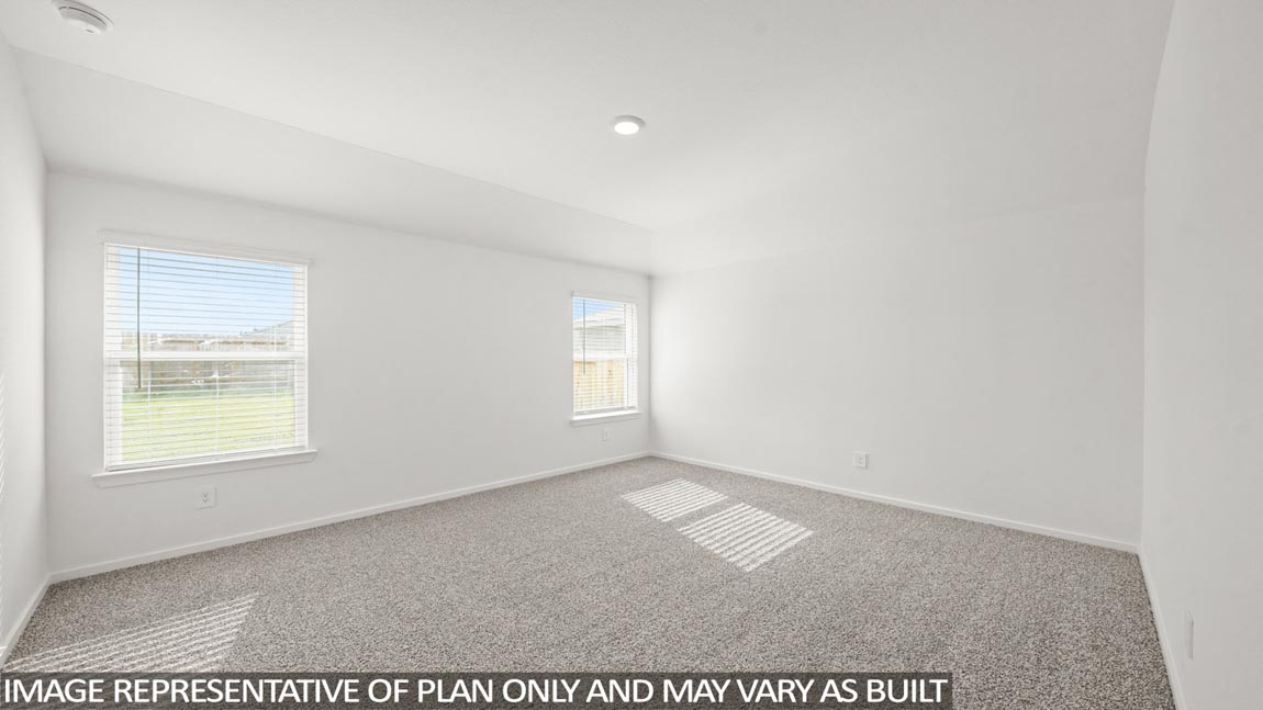 Primary bedroom with carpet flooring