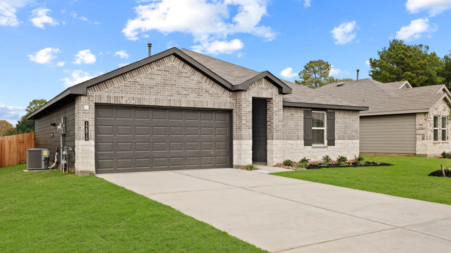 Single-story home with brown trim and a two-car garage.