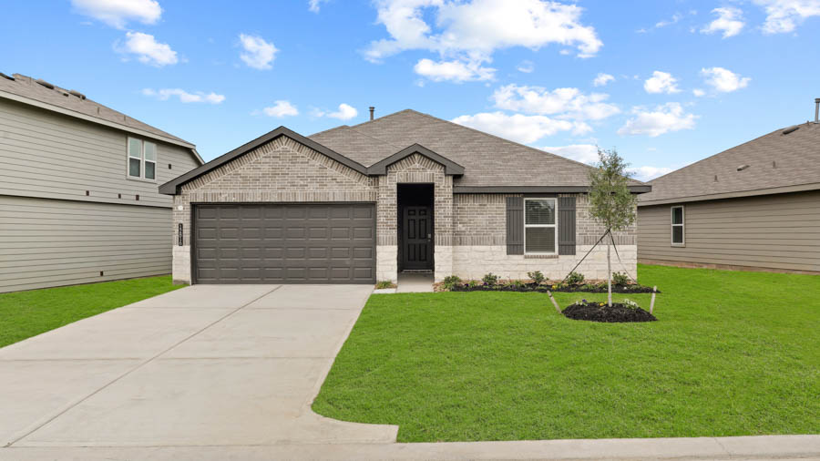 Single-story home with brown trim and a two-car garage.