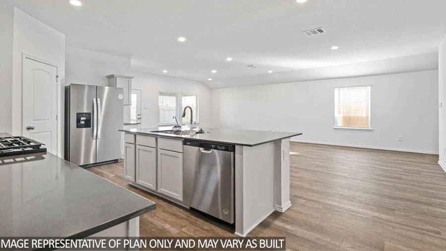 Kitchen with island and stainless-steel appliances.