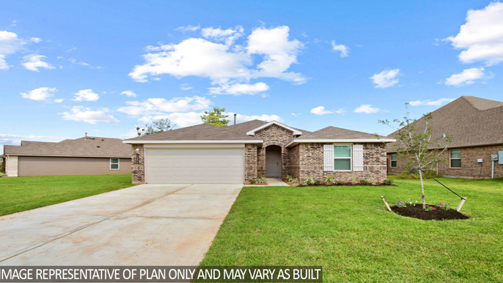 Single-story home with tan trim and a two-car garage.