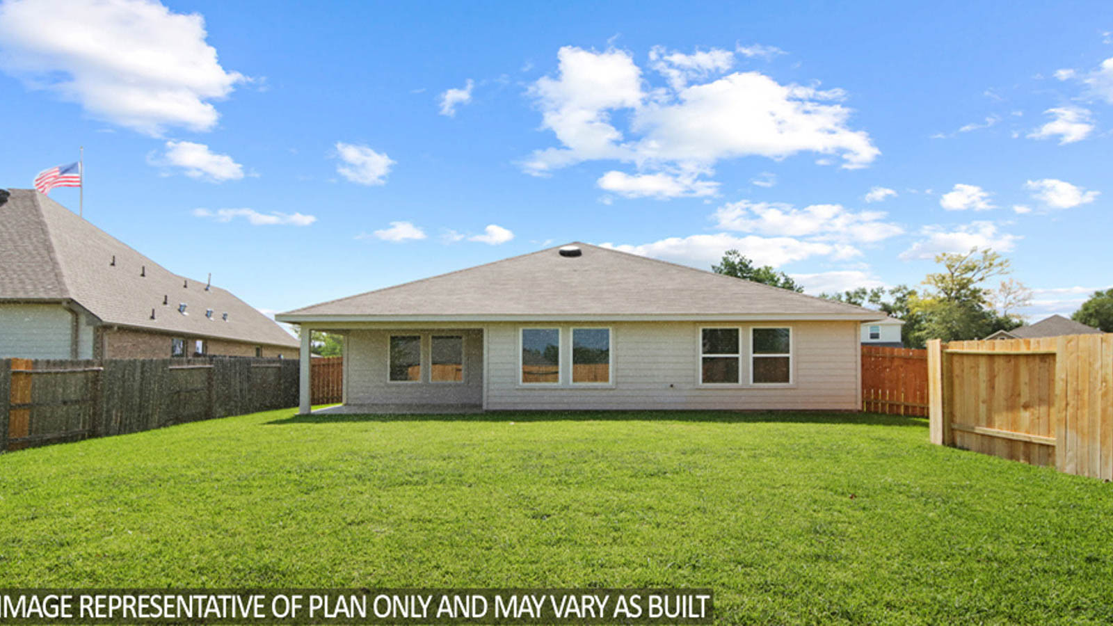 Spacious backyard with patio.