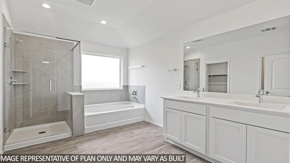 Primary flooring with tub, shower, and double sinks