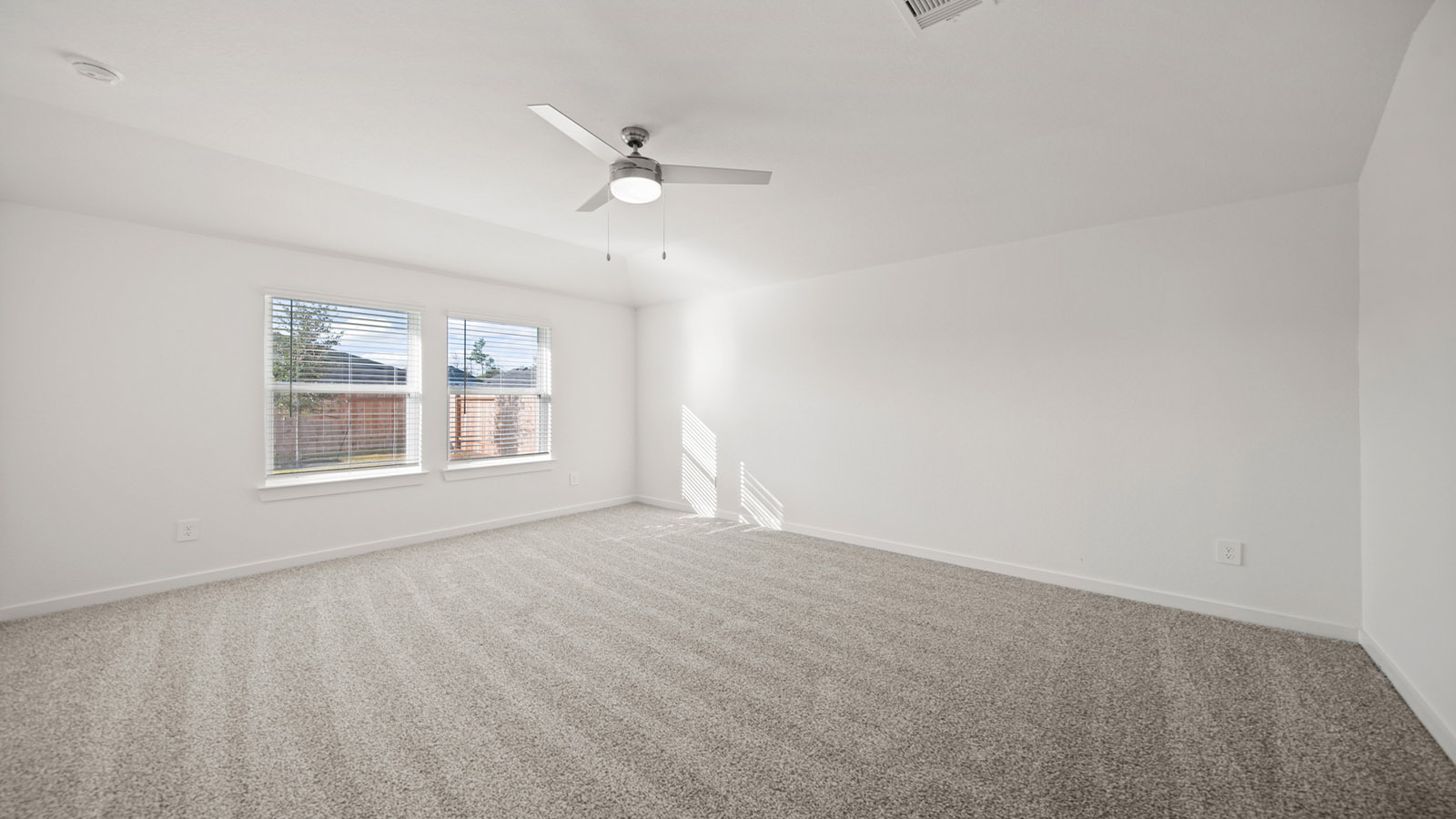 Primary bedroom with carpet flooring