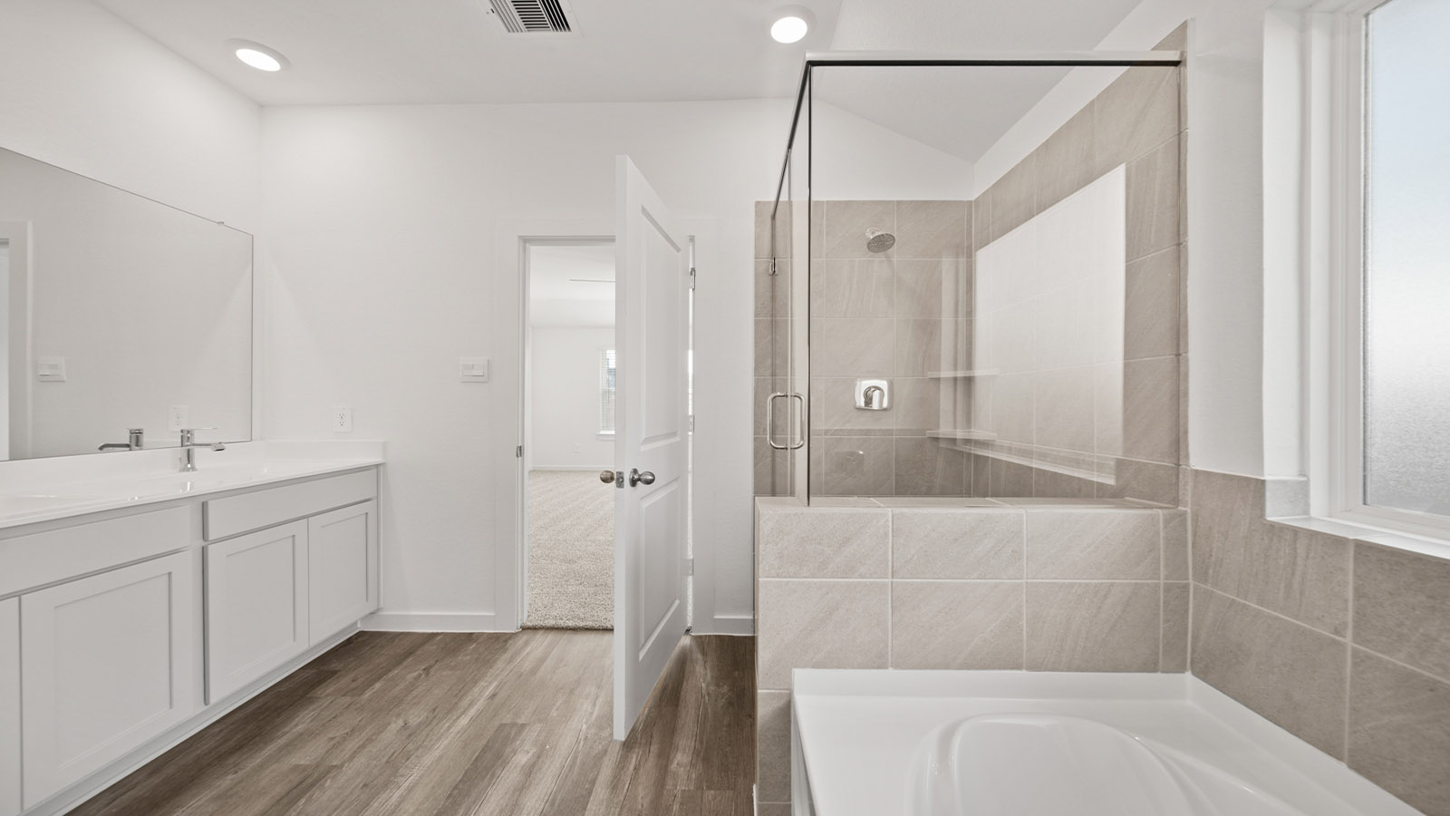 Primary bathroom with tub and shower