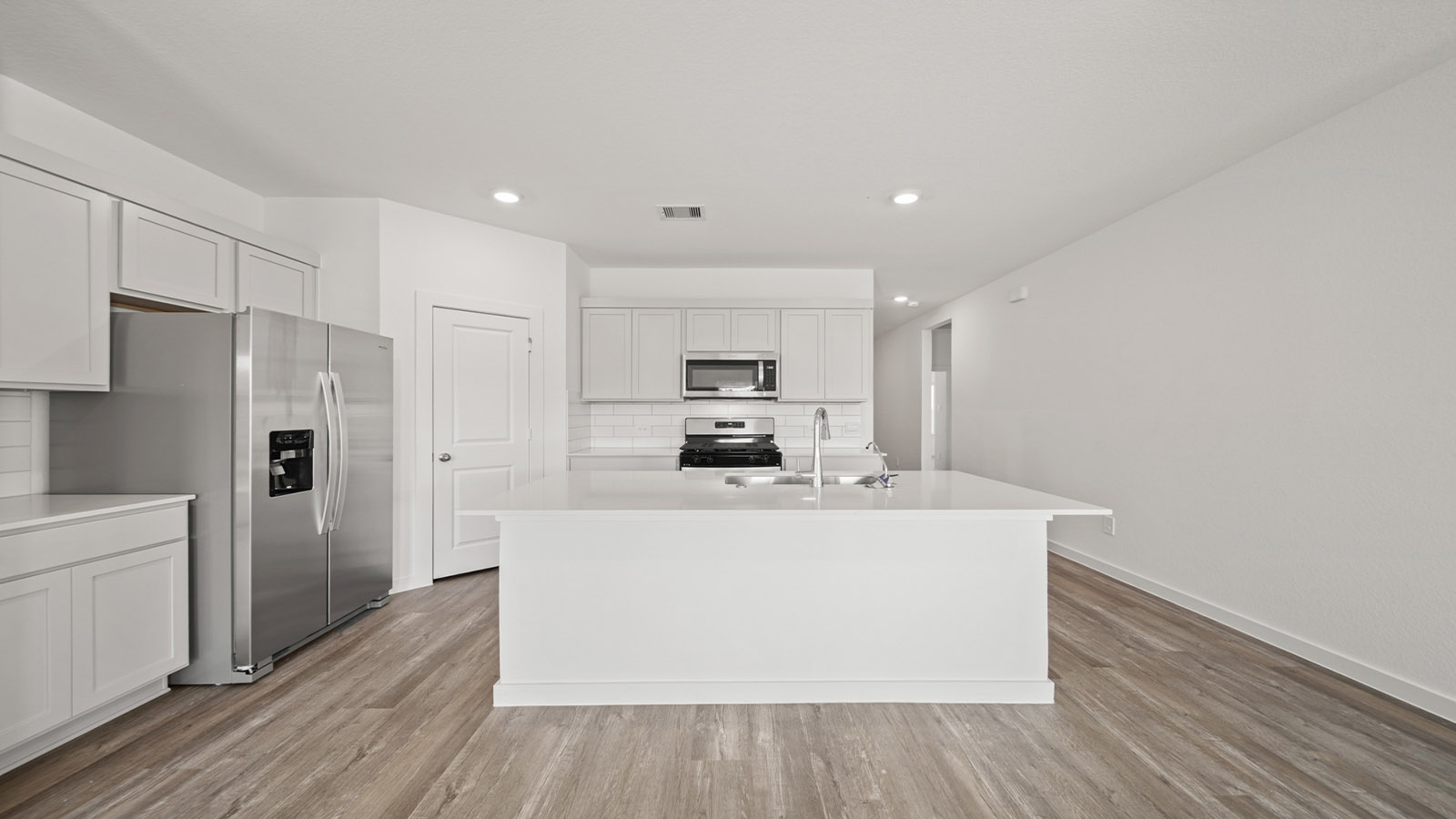 Open concept living, dining, and kitchen area