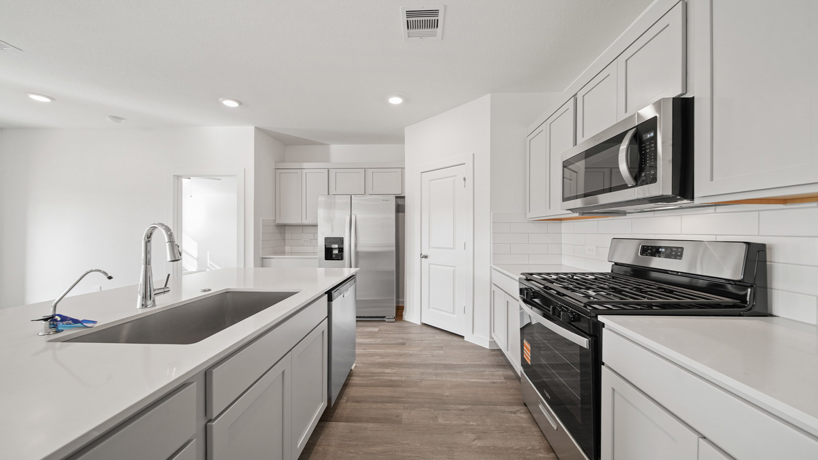 Open concept living, dining, and kitchen area