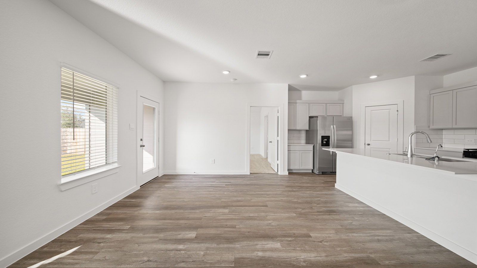 Open concept living, dining, and kitchen area