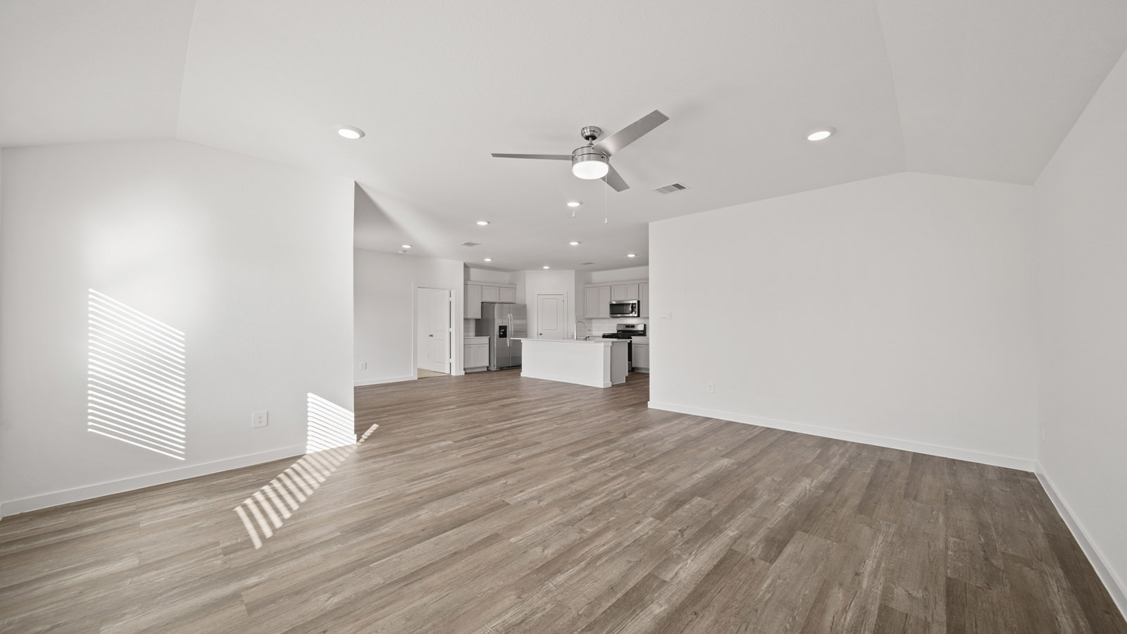 Open concept living, dining, and kitchen area