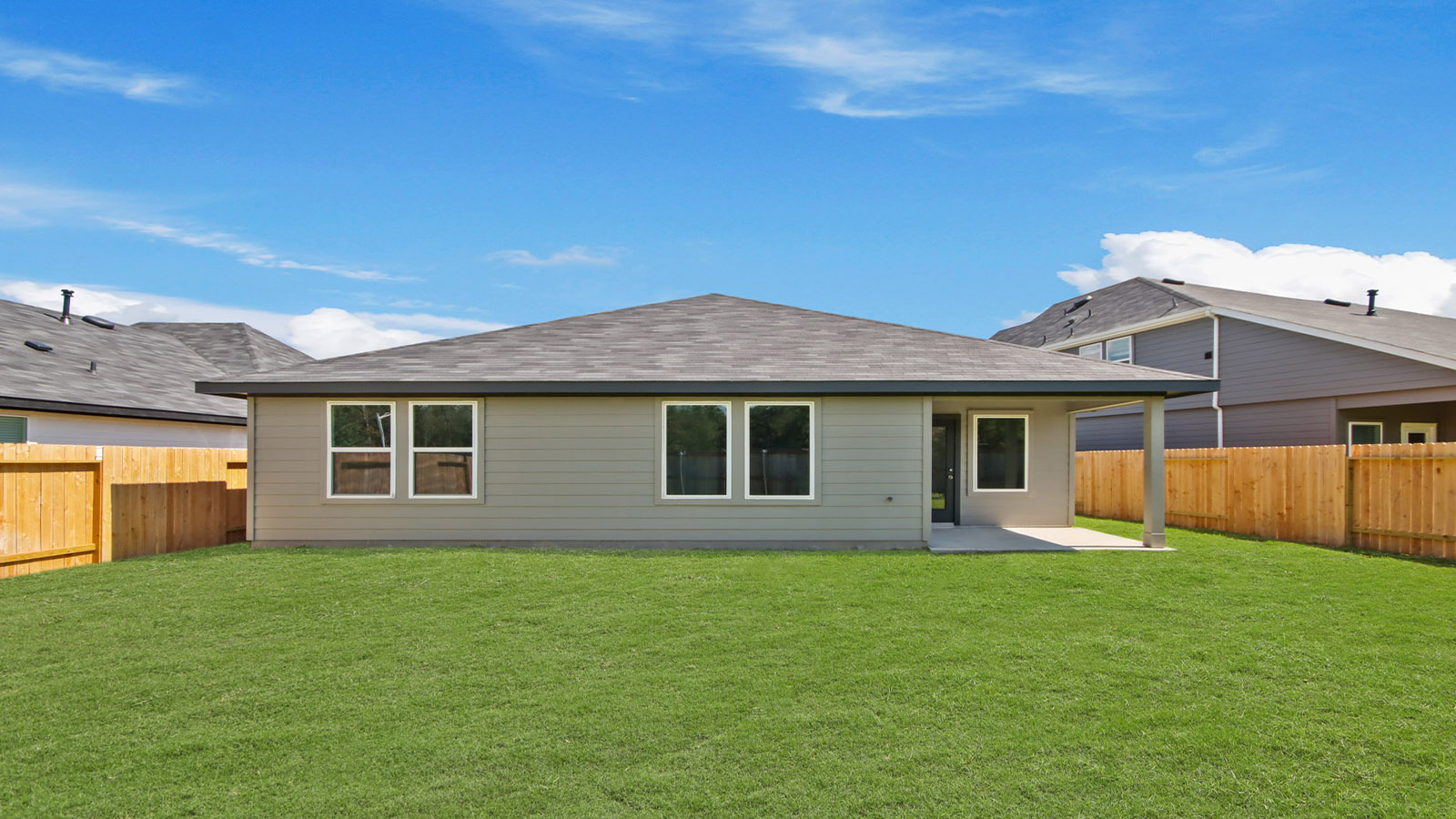 Backyard featuring a covered paved patio ideal for seating, grilling, and outdoor living Silverthorne