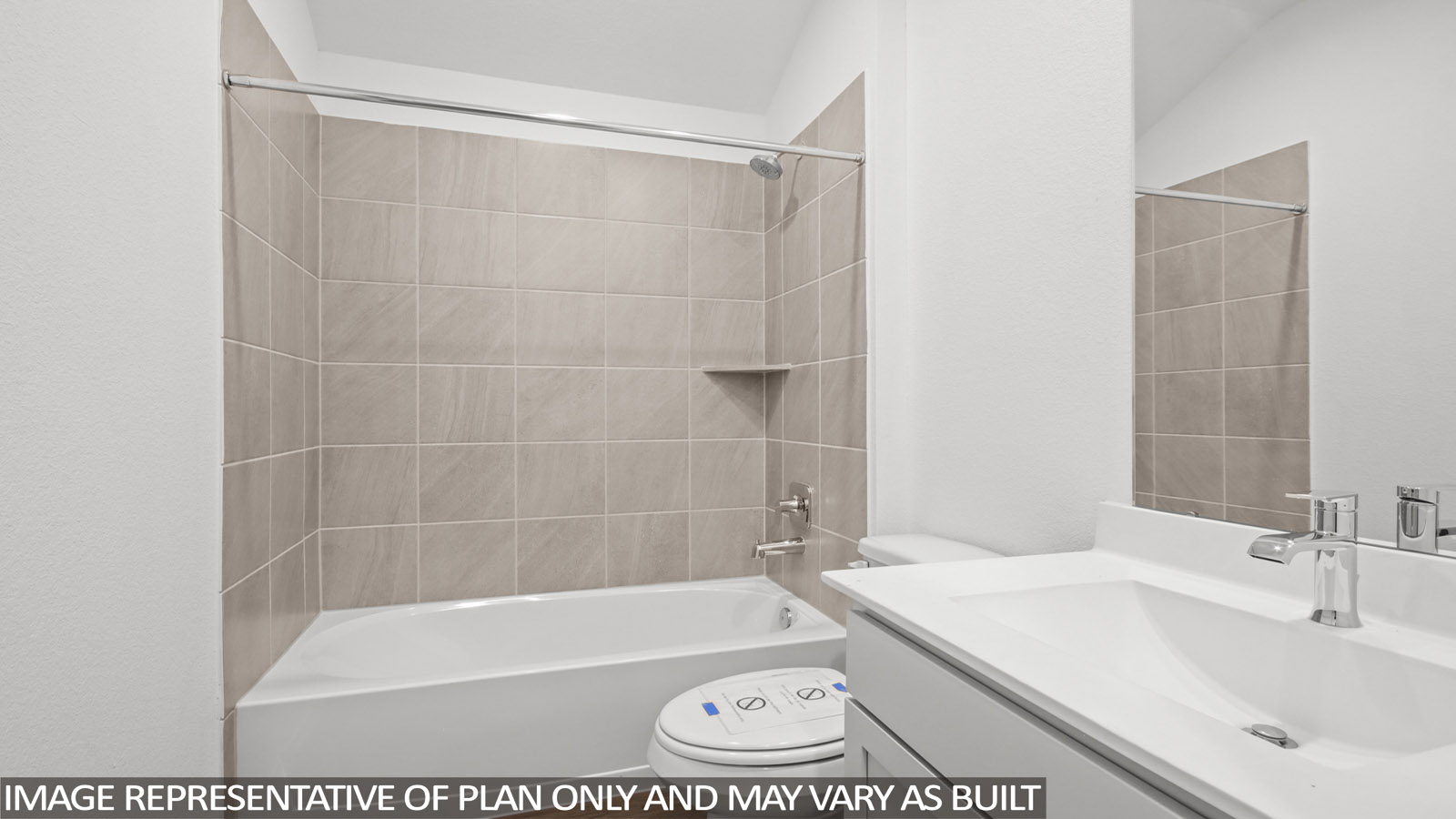 Secondary bathroom with a tile tub/shower combo and vinyl flooring.