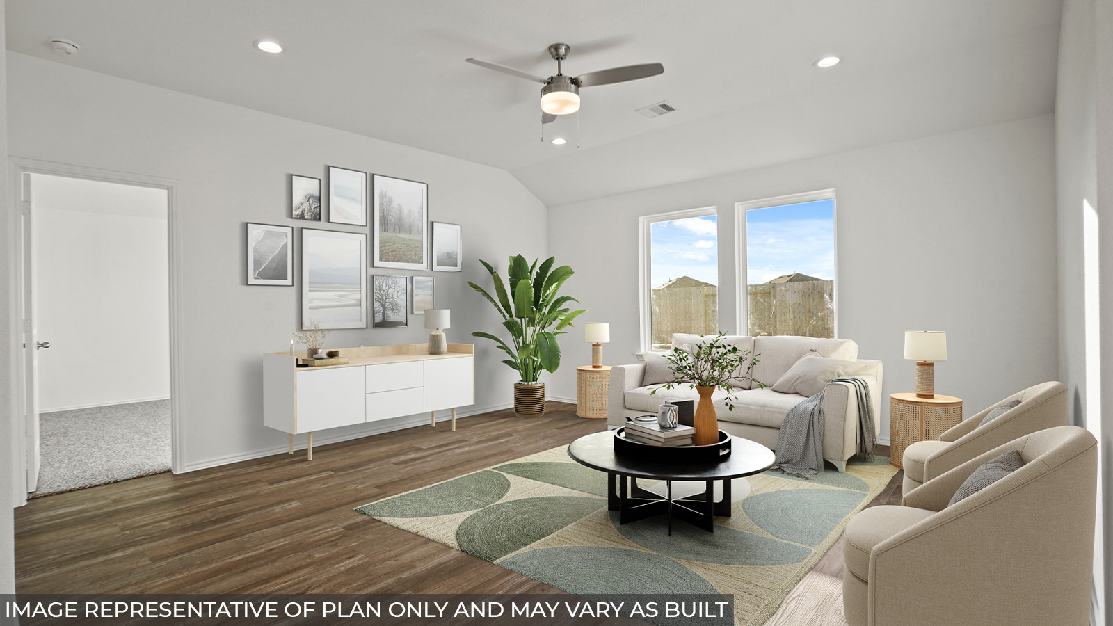 Staged open concept living and dining area with vinyl flooring and bright windows.