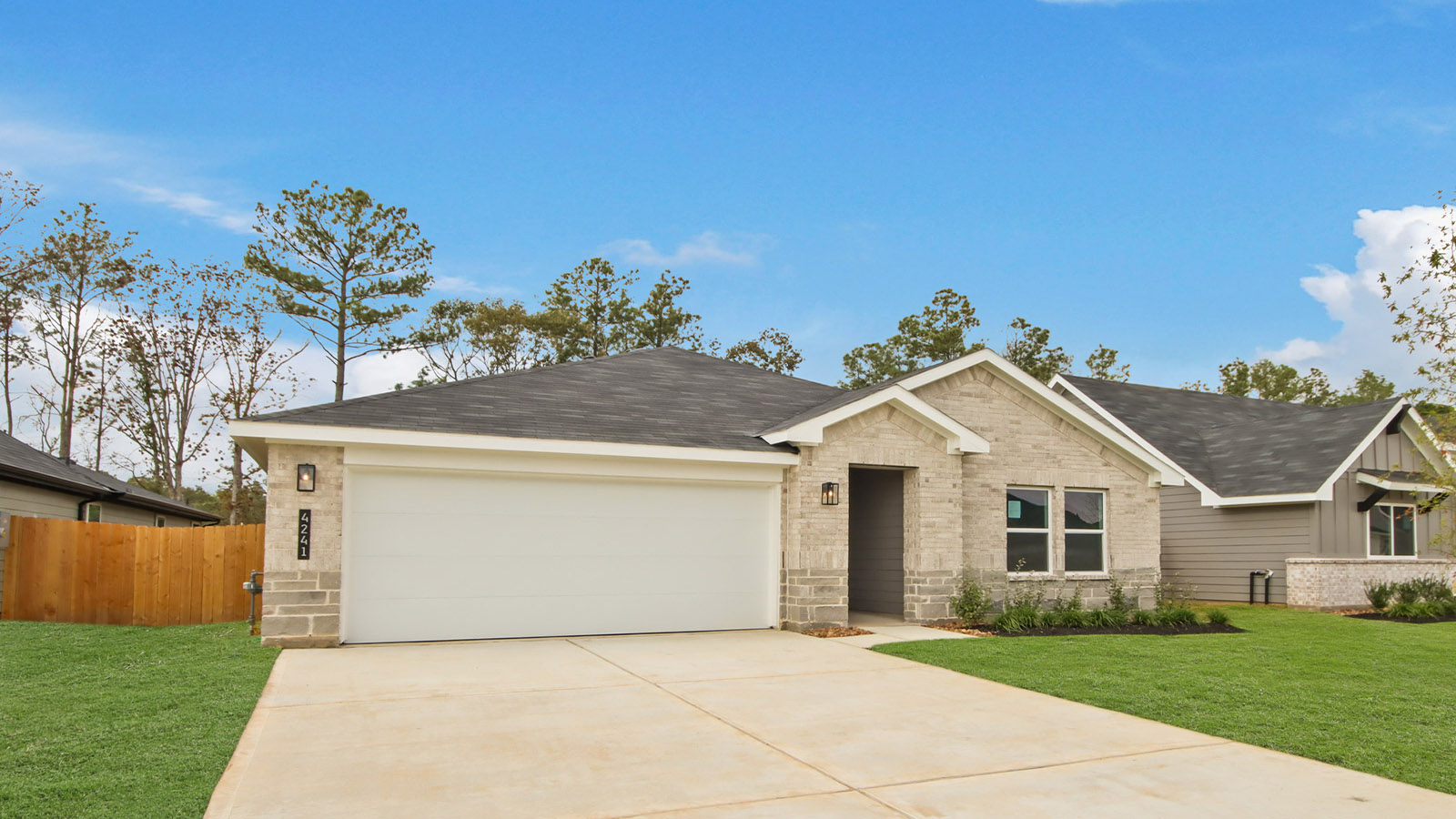 Neighborhood street view of Silverthorne by D.R. Horton with front porch designs and curb appeal