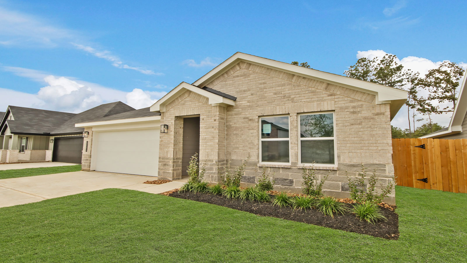 Silverthorne D.R. Horton streetscape with new build home, front yard, landscaping, and garage view
