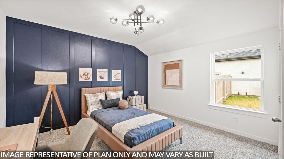 Secondary bedroom with carpet flooring