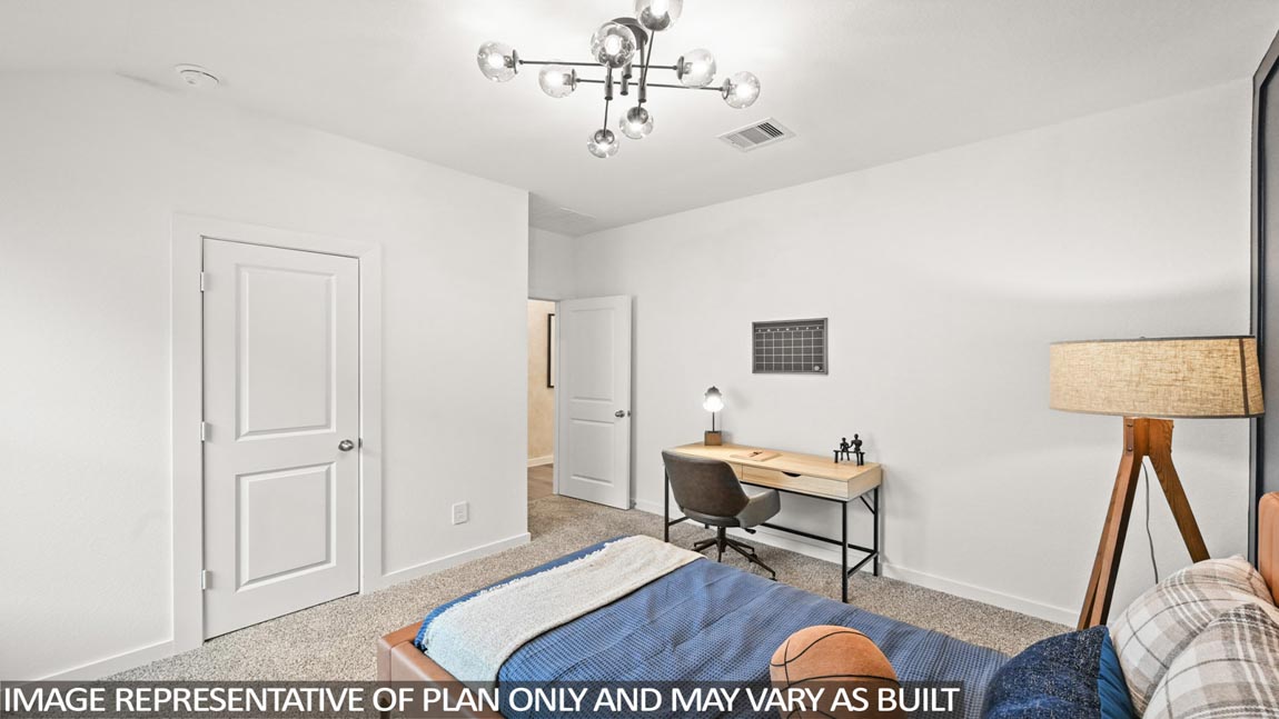 Secondary bedroom with carpet flooring