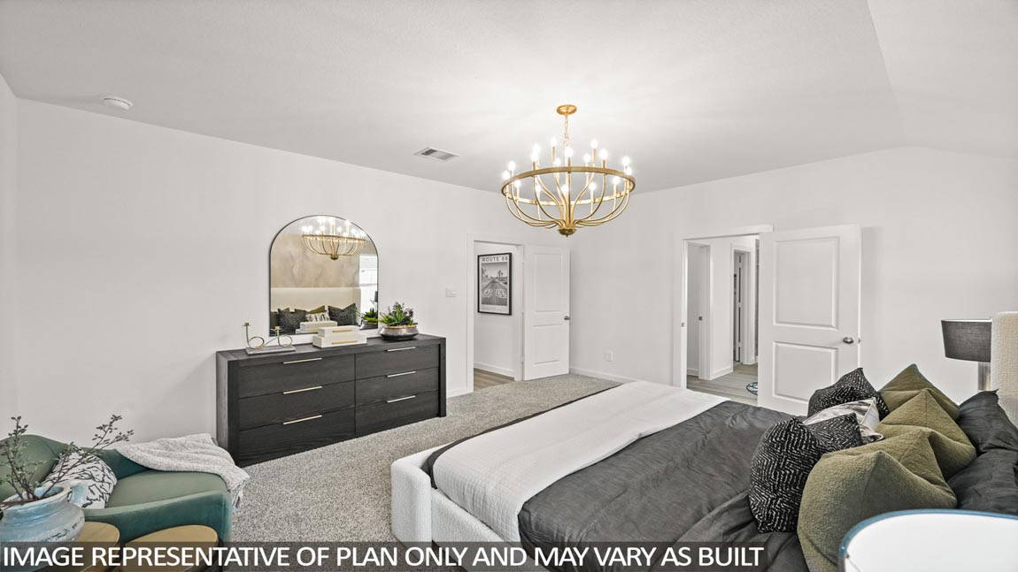 Primary bedroom with bright windows