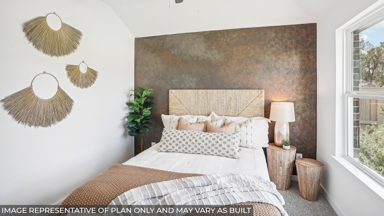 Staged secondary bedroom with carpet flooring and a bright window.