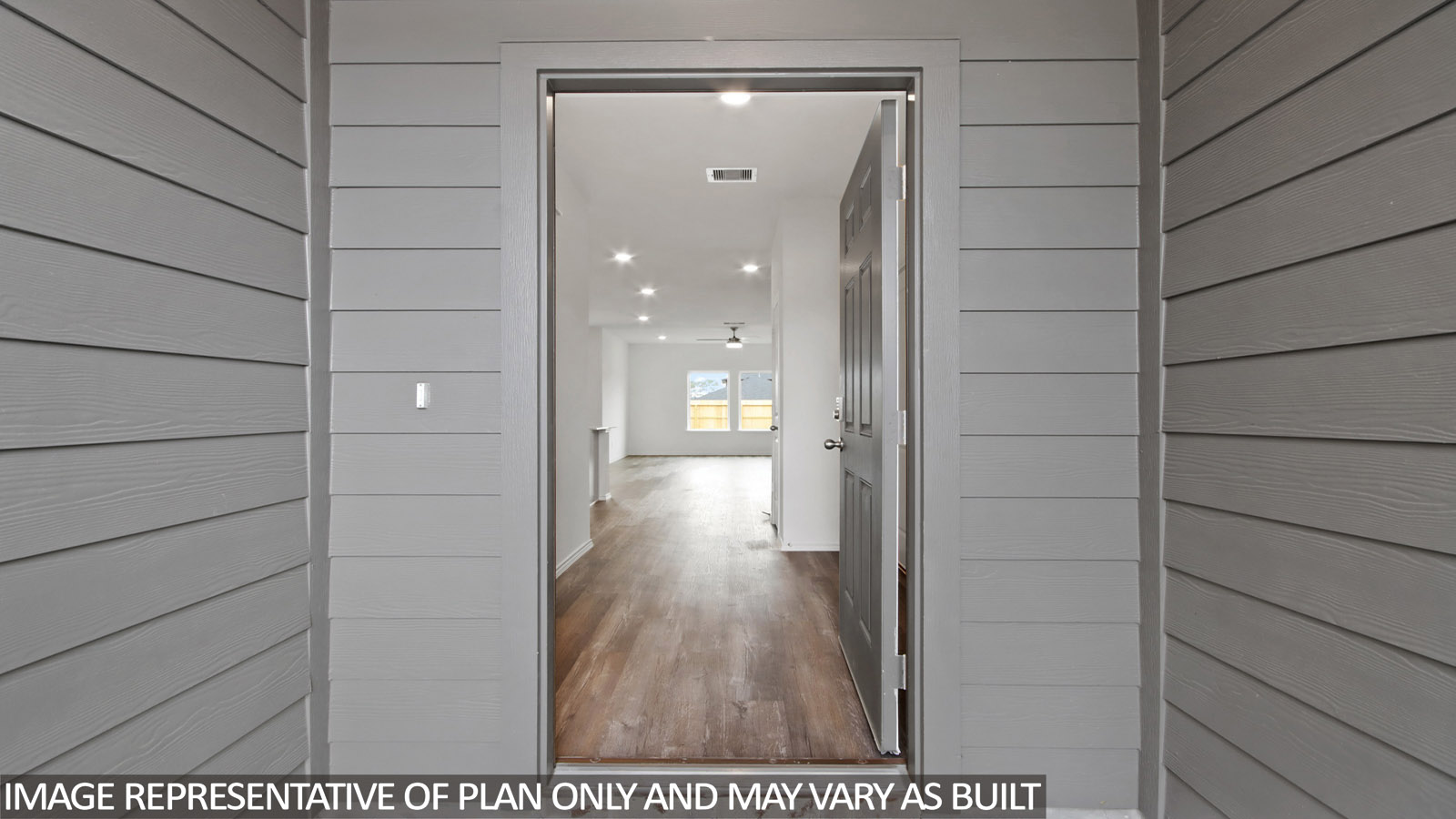 Entryway and foyer with vinyl flooring.