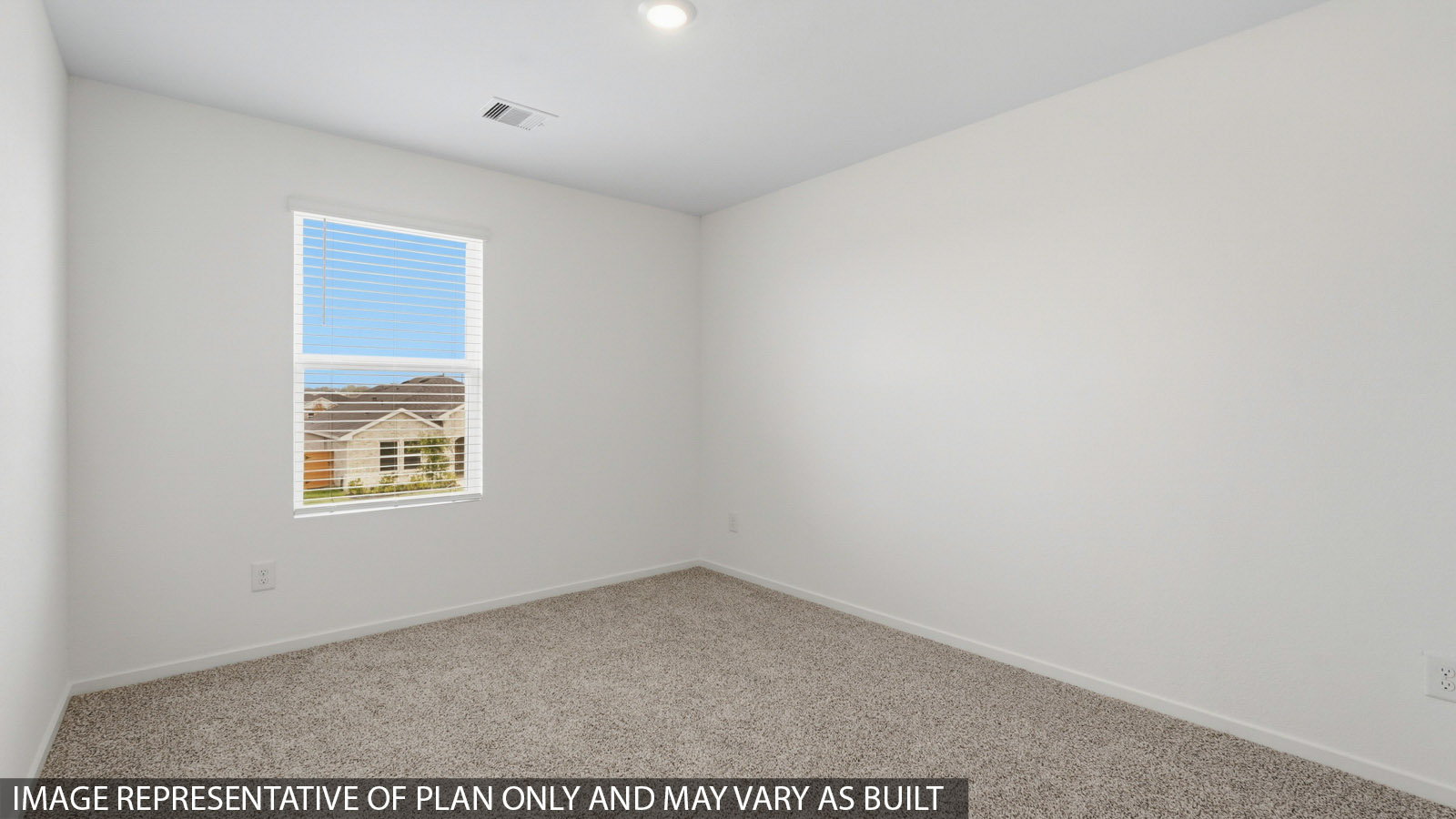 Secondary bedroom with carpet flooring