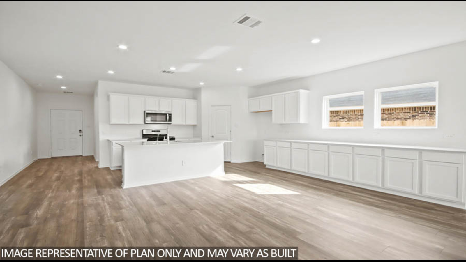 Open concept living, dining, and kitchen area