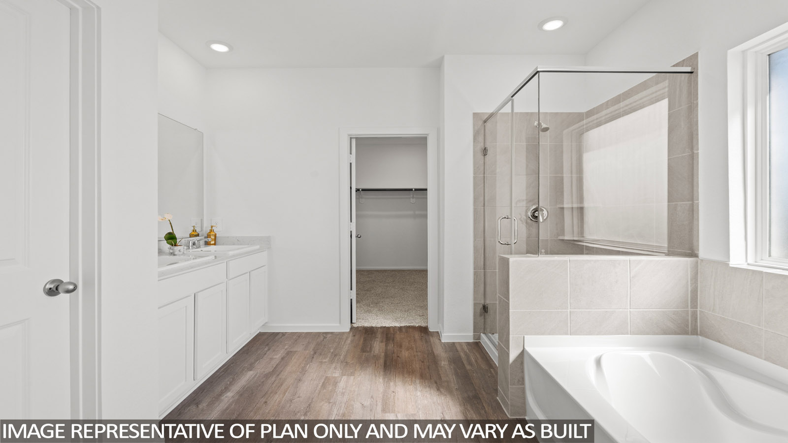 Primary bathroom with tub and shower