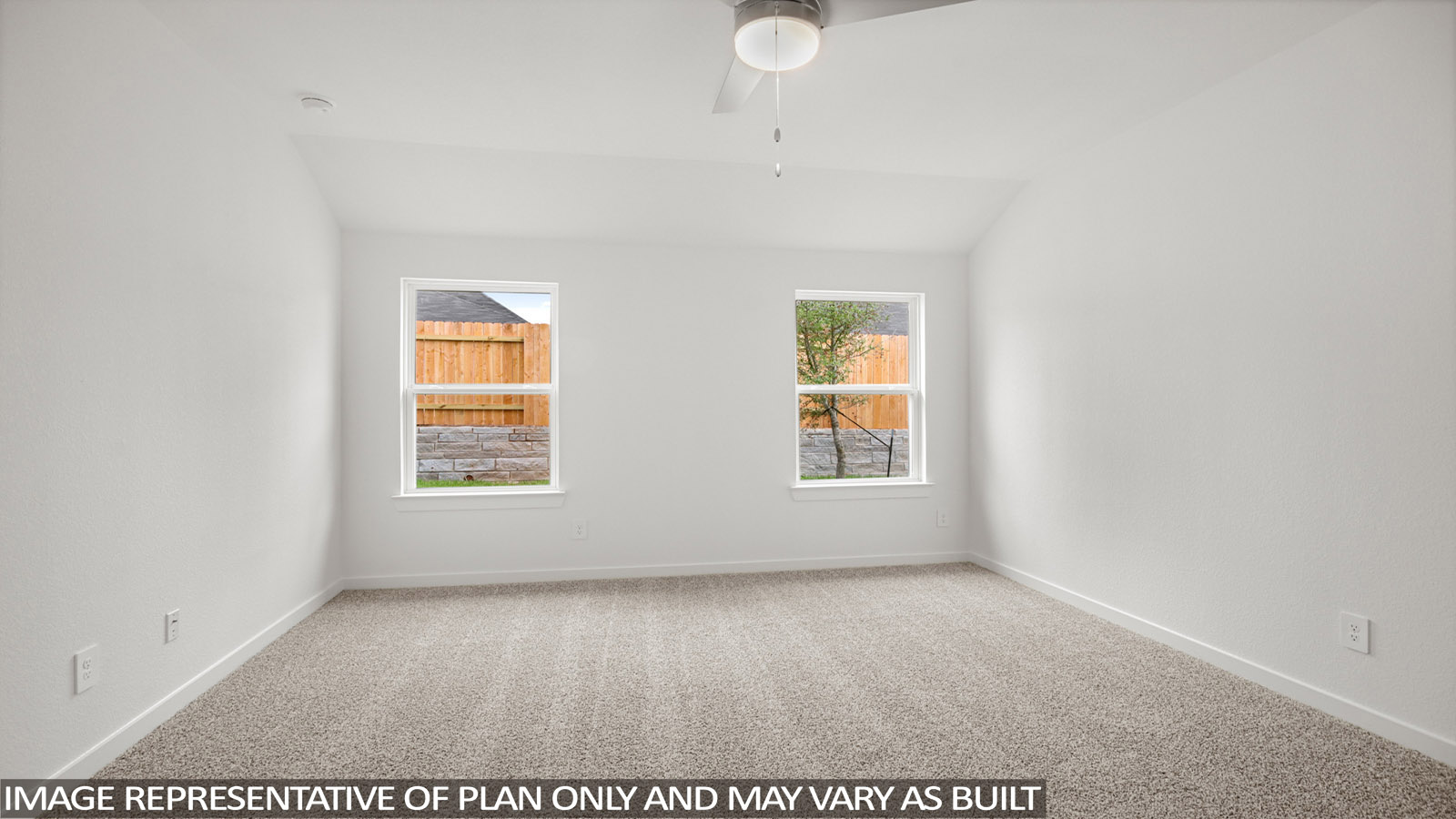 Primary bedroom with bright windows