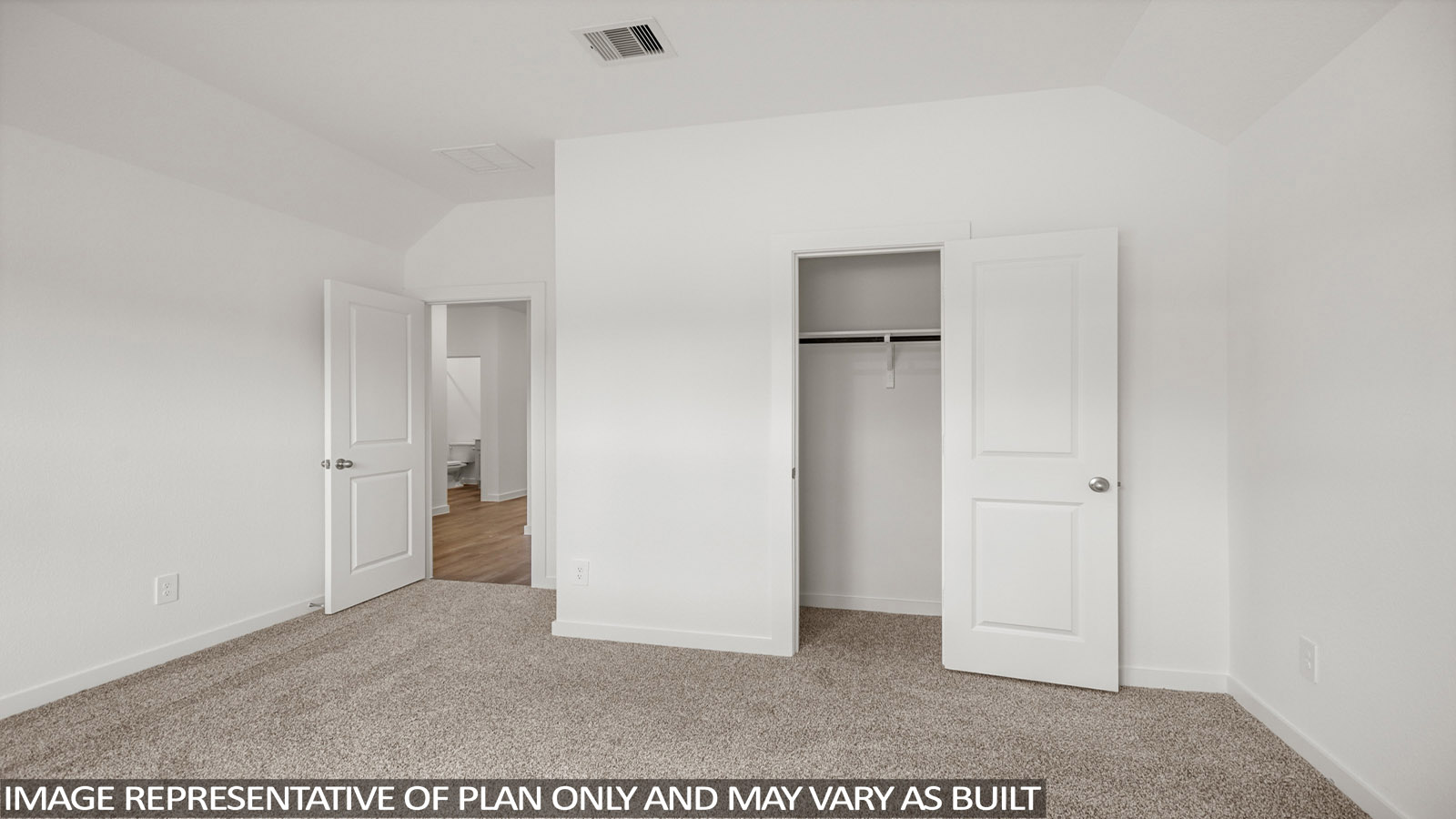 Secondary bedroom with carpet flooring
