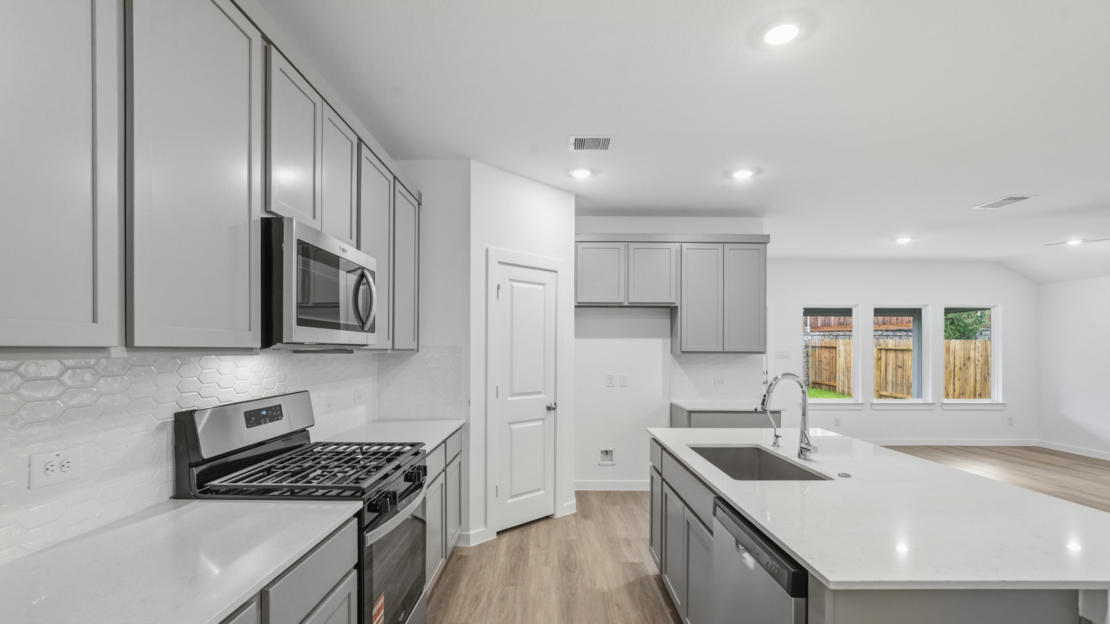 Open concept living, dining, and kitchen area