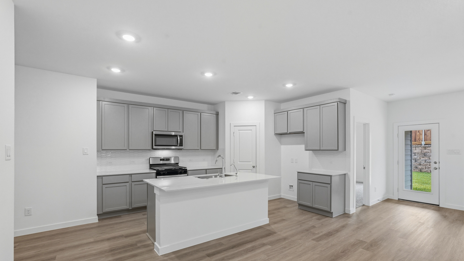 Open concept living, dining, and kitchen area