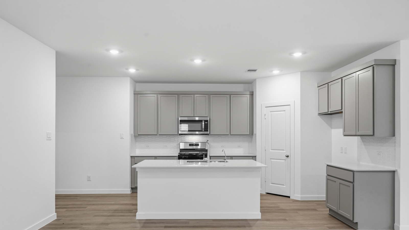 Open concept living, dining, and kitchen area