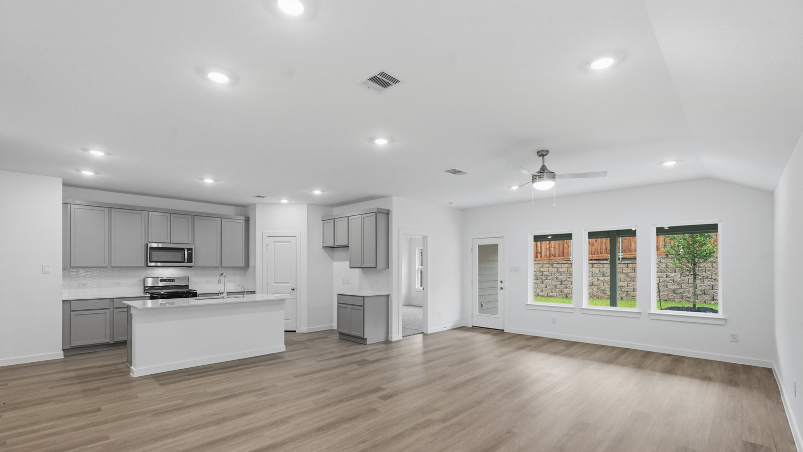 Open concept living, dining, and kitchen area