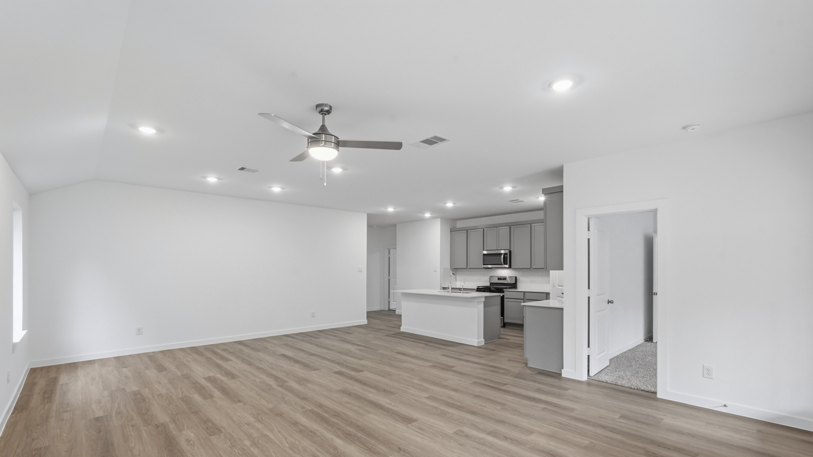 Open concept living, dining, and kitchen area