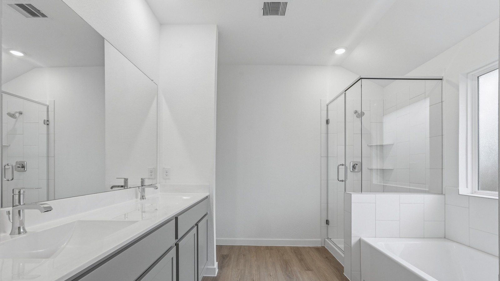 Primary bathroom with tub and shower