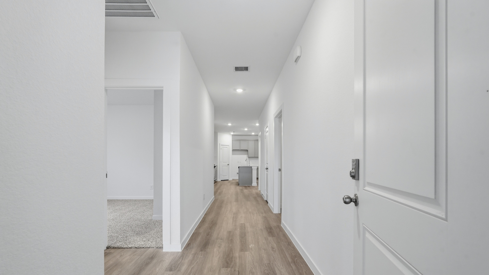 Entry hallway with vinyl flooring