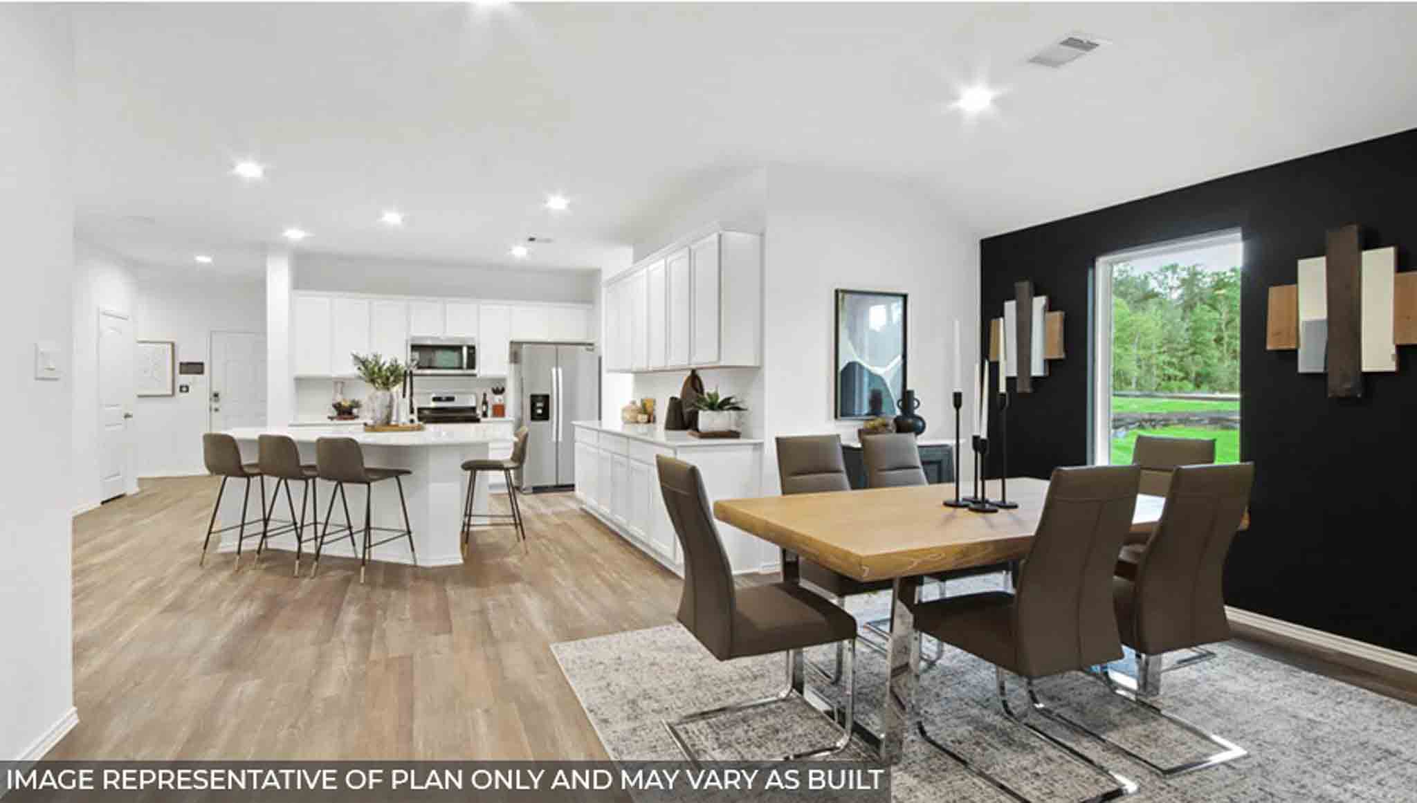 Open concept living and dining area with vinyl flooring and bright windows.