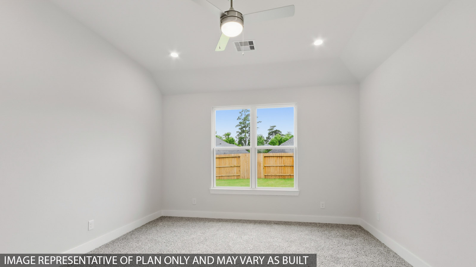 Primary bedroom with carpet flooring