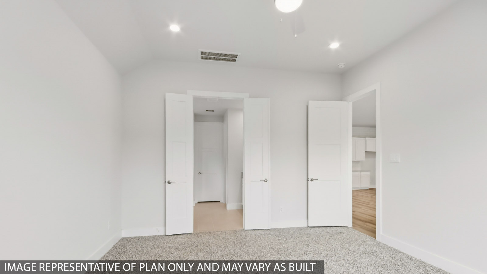 Primary bedroom with carpet flooring