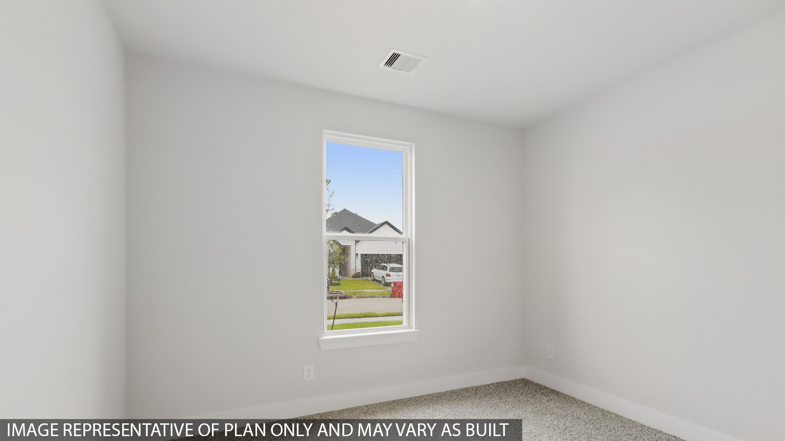 Secondary bedroom with carpet flooring