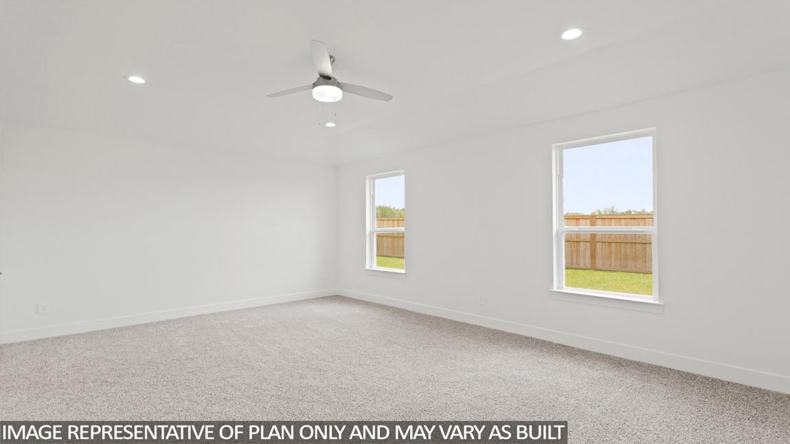 Primary bedroom with carpet flooring