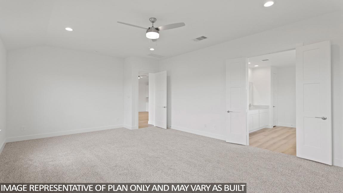 Primary bedroom with carpet flooring