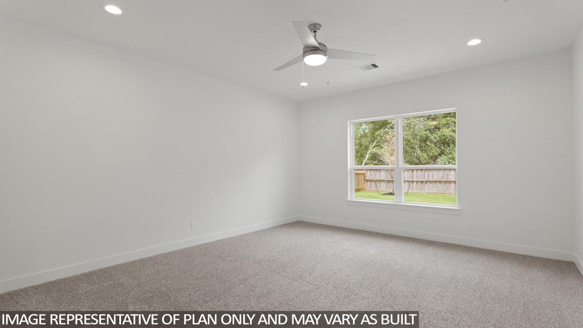 Primary bedroom with carpet flooring